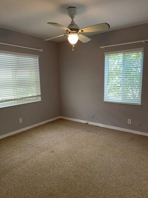 5433 NE 5th Ave, Oakland Park, FL 33334 - carpeted spare room featuring a ceiling fan and baseboards