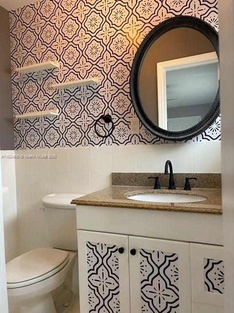 5433 NE 5th Ave, Oakland Park, FL 33334 - bathroom with tile walls and vanity