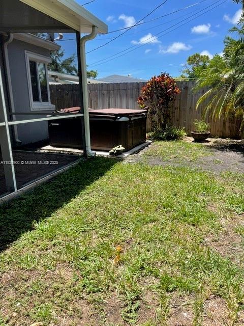 5433 NE 5th Ave, Oakland Park, FL 33334 - view of yard with a hot tub