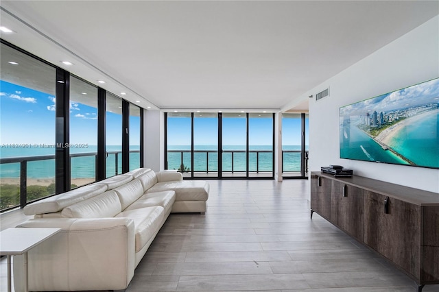 9455 Collins Ave Unit 809, Surfside, FL 33154 - living area featuring floor to ceiling windows, light wood-type flooring, healthy amount of natural light, and recessed lighting