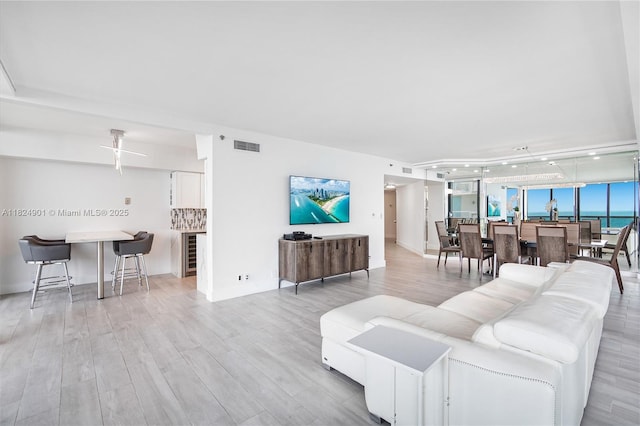 9455 Collins Ave Unit 809, Surfside, FL 33154 - living area featuring light wood finished floors and wine cooler