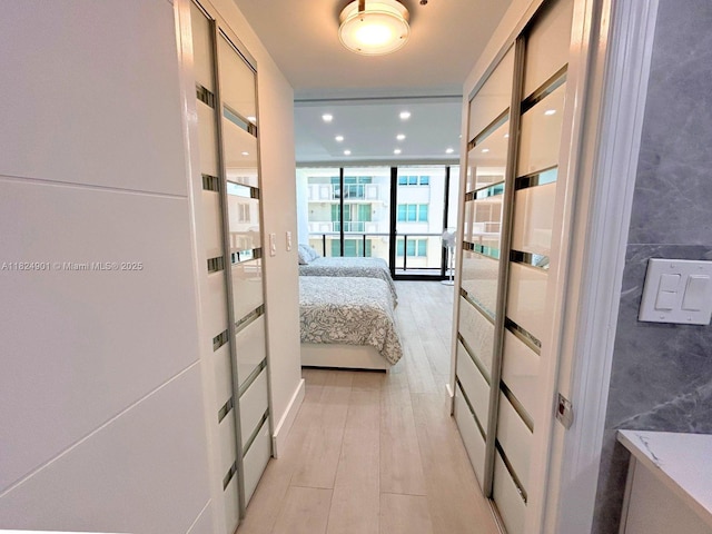 9455 Collins Ave Unit 809, Surfside, FL 33154 - corridor with floor to ceiling windows, tile walls, and recessed lighting