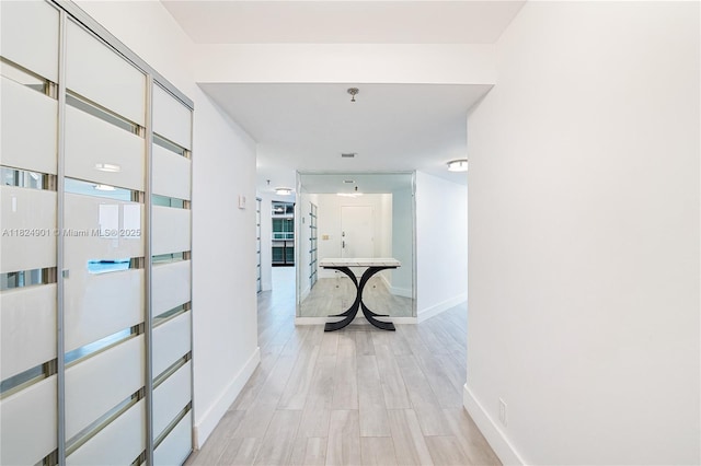 9455 Collins Ave Unit 809, Surfside, FL 33154 - corridor with baseboards and light wood-type flooring