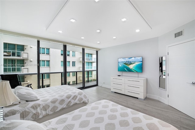 9455 Collins Ave Unit 809, Surfside, FL 33154 - bedroom featuring wood finished floors, access to exterior, and recessed lighting