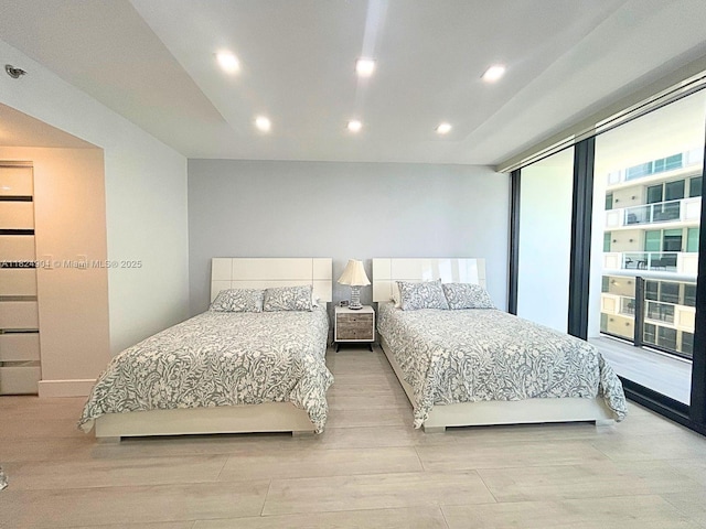 9455 Collins Ave Unit 809, Surfside, FL 33154 - bedroom featuring light wood-style flooring and recessed lighting