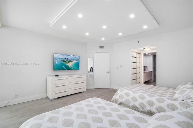 9455 Collins Ave Unit 809, Surfside, FL 33154 - bedroom with light wood-style floors, recessed lighting, and connected bathroom