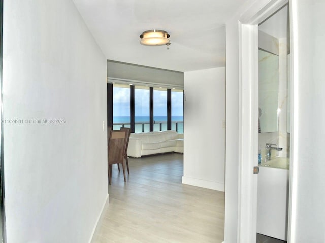 9455 Collins Ave Unit 809, Surfside, FL 33154 - hall with baseboards and light wood-style flooring