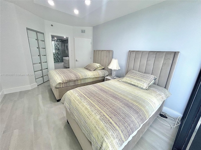 9455 Collins Ave Unit 809, Surfside, FL 33154 - bedroom featuring light wood-type flooring and recessed lighting