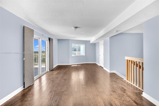 280 SW 20th Rd Unit 904, Miami, FL 33129 - empty room featuring dark wood-style flooring, plenty of natural light, and a smoke detector