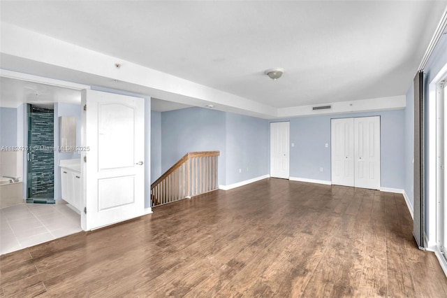 280 SW 20th Rd Unit 904, Miami, FL 33129 - unfurnished living room featuring wood finished floors and baseboards