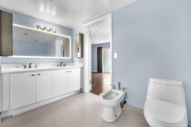 280 SW 20th Rd Unit 904, Miami, FL 33129 - bathroom featuring a bidet, double vanity, and tile patterned flooring