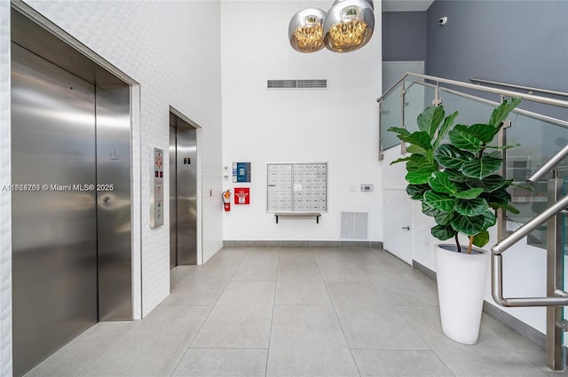 280 SW 20th Rd Unit 904, Miami, FL 33129 - lobby with a high ceiling and a surveillance system