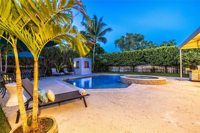 433 NE 91st St, Miami Shores, FL 33138 - view of pool featuring a patio, a fenced backyard, and a pool with connected hot tub