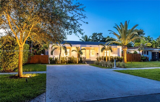 433 NE 91st St, Miami Shores, FL 33138 - mediterranean / spanish home featuring concrete driveway and stucco siding
