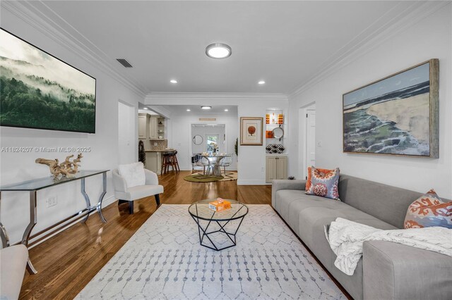 433 NE 91st St, Miami Shores, FL 33138 - living room with wood finished floors, crown molding, and recessed lighting