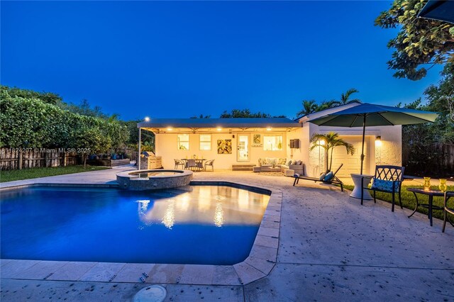 433 NE 91st St, Miami Shores, FL 33138 - pool at twilight with a patio, a pool with connected hot tub, and outdoor lounge area