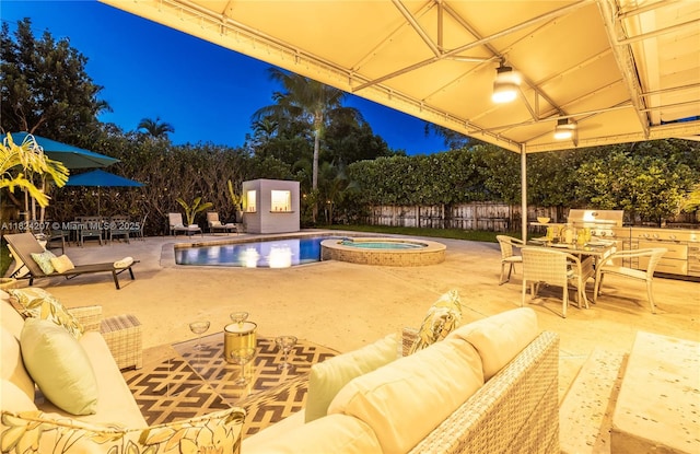 433 NE 91st St, Miami Shores, FL 33138 - pool at night featuring outdoor lounge area, outdoor dining space, a grill, and a patio