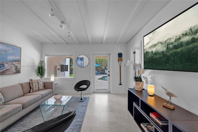 433 NE 91st St, Miami Shores, FL 33138 - living area featuring track lighting, beam ceiling, and light tile patterned floors