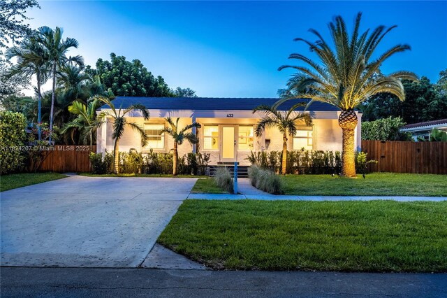 433 NE 91st St, Miami Shores, FL 33138 - mediterranean / spanish-style home with concrete driveway and stucco siding