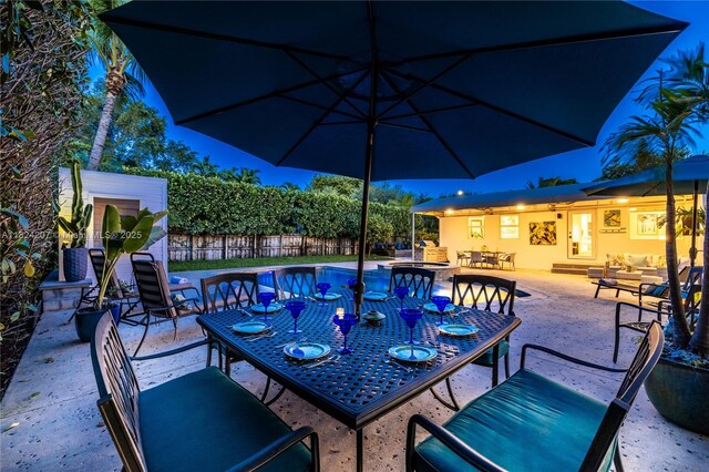 433 NE 91st St, Miami Shores, FL 33138 - fenced backyard featuring outdoor dining area, outdoor lounge area, a pool with connected hot tub, and a patio area