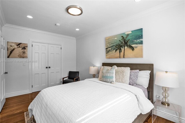 433 NE 91st St, Miami Shores, FL 33138 - bedroom featuring crown molding, wood finished floors, a closet, and recessed lighting