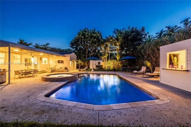 433 NE 91st St, Miami Shores, FL 33138 - view of swimming pool with a patio and a pool with connected hot tub