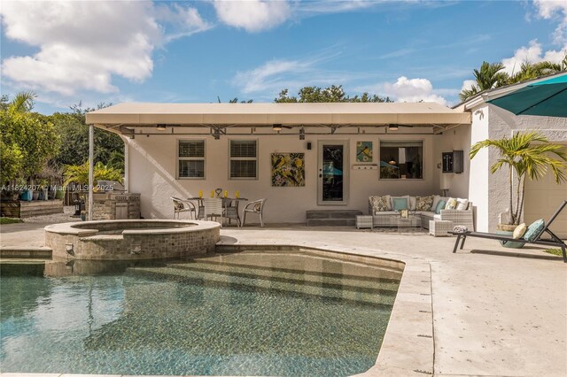 433 NE 91st St, Miami Shores, FL 33138 - rear view of house featuring a patio area, an outdoor hangout area, stucco siding, and a pool with connected hot tub