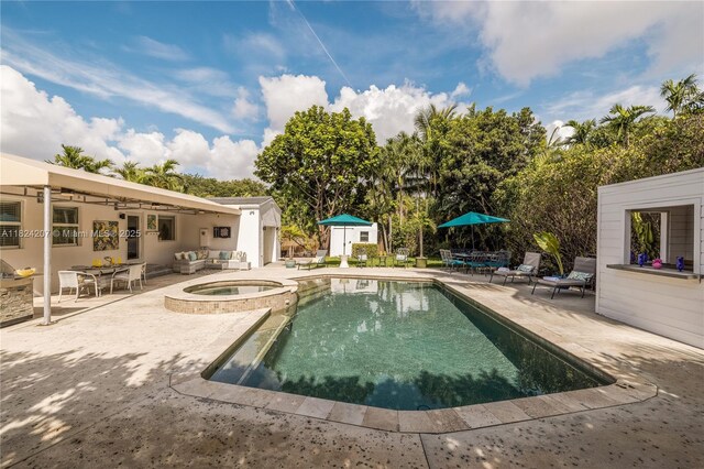 433 NE 91st St, Miami Shores, FL 33138 - view of swimming pool featuring a patio area, outdoor dining area, a pool with connected hot tub, and an outdoor living space