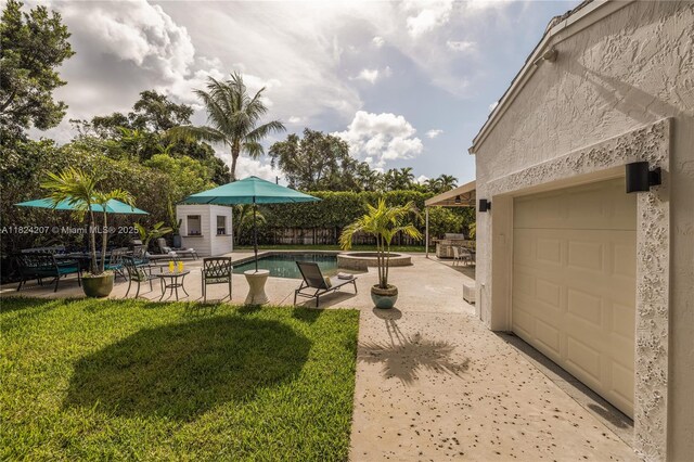 433 NE 91st St, Miami Shores, FL 33138 - view of pool with a patio area, a lawn, an outbuilding, and a pool with connected hot tub