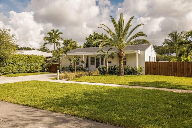 433 NE 91st St, Miami Shores, FL 33138 - view of front facade with stucco siding and concrete driveway