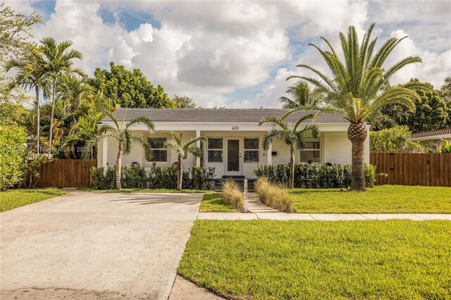 433 NE 91st St, Miami Shores, FL 33138 - view of front of property featuring stucco siding and driveway
