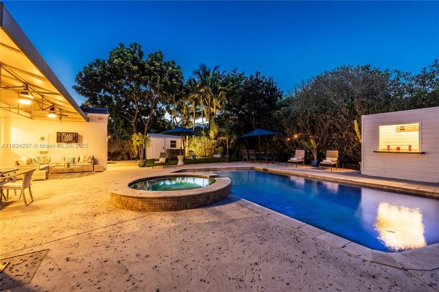 433 NE 91st St, Miami Shores, FL 33138 - view of swimming pool featuring a patio area, a pool with connected hot tub, and an outdoor living space