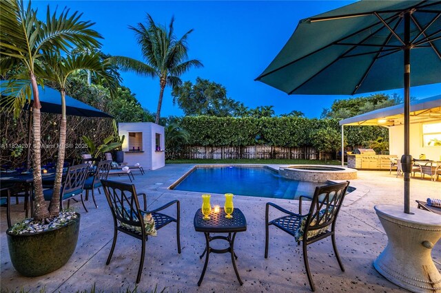 433 NE 91st St, Miami Shores, FL 33138 - view of swimming pool with a fenced backyard, an outbuilding, outdoor dining space, and a patio