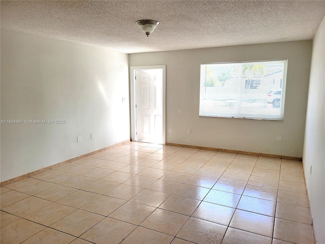 1800 SW 97th Ave, Miramar, FL 33025 - empty room featuring light tile patterned floors and a textured ceiling