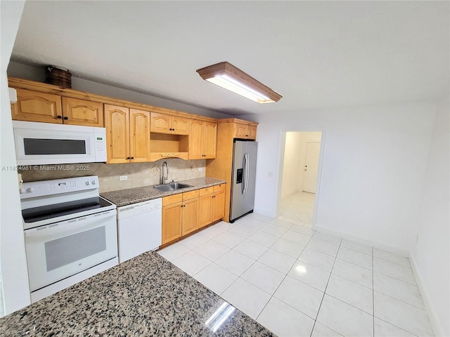 1800 SW 97th Ave, Miramar, FL 33025 - kitchen featuring white appliances, decorative backsplash, dark stone countertops, and light tile patterned floors