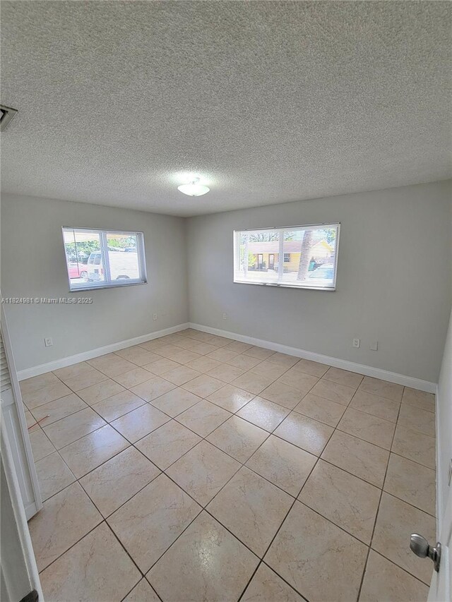 1800 SW 97th Ave, Miramar, FL 33025 - spare room with light tile patterned floors and a textured ceiling