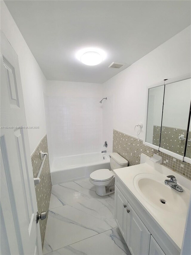 1800 SW 97th Ave, Miramar, FL 33025 - bathroom with tile walls, vanity, shower / bath combination, a wainscoted wall, and marble finish flooring