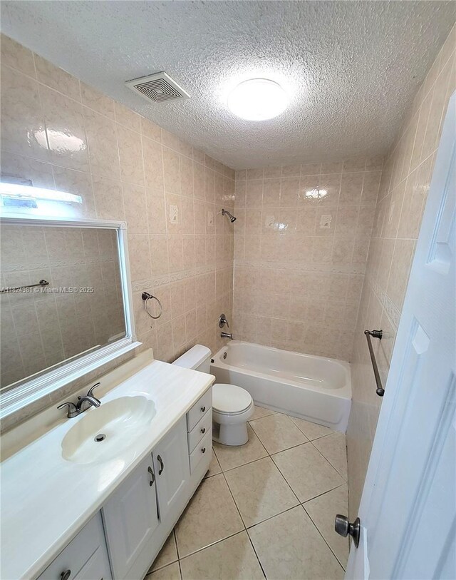 1800 SW 97th Ave, Miramar, FL 33025 - full bath featuring tile walls, vanity, tile patterned floors, shower / washtub combination, and a textured ceiling