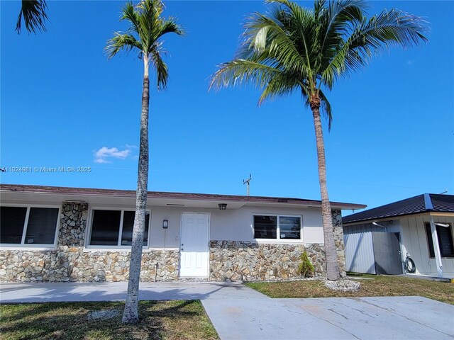 1800 SW 97th Ave, Miramar, FL 33025 - ranch-style house featuring stone siding and stucco siding
