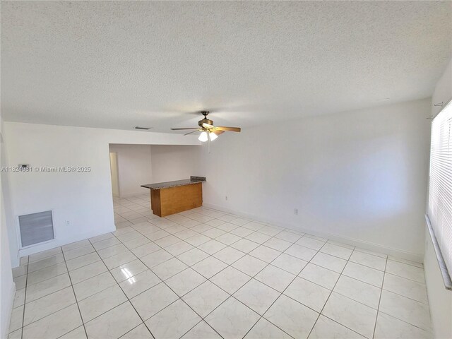 1800 SW 97th Ave, Miramar, FL 33025 - empty room with ceiling fan, a textured ceiling, and light tile patterned floors