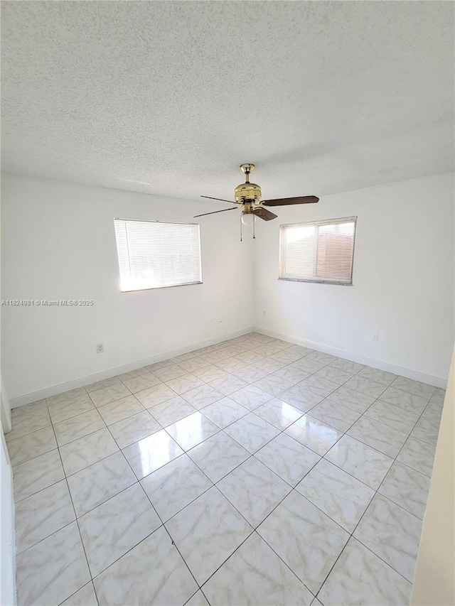 1800 SW 97th Ave, Miramar, FL 33025 - unfurnished room with plenty of natural light, a textured ceiling, and ceiling fan