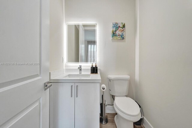 1101 NE 16th Ter Unit 1, Fort Lauderdale, FL 33304 - half bathroom featuring toilet and vanity