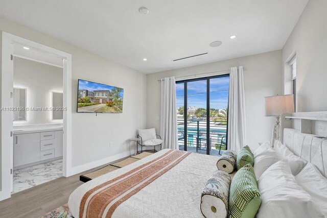 1101 NE 16th Ter Unit 1, Fort Lauderdale, FL 33304 - bedroom with recessed lighting, ensuite bathroom, and light marble finish flooring