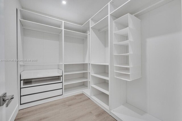 1101 NE 16th Ter Unit 1, Fort Lauderdale, FL 33304 - walk in closet featuring wood finished floors