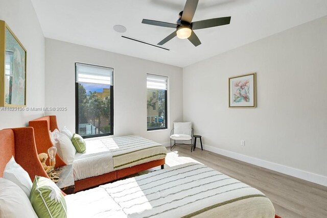 1101 NE 16th Ter Unit 1, Fort Lauderdale, FL 33304 - bedroom with wood finished floors and a ceiling fan