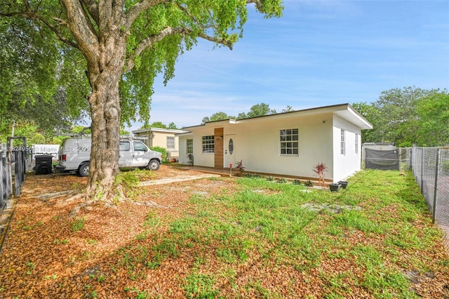 1355 NW 121st St, North Miami, FL 33167 - rear view of house with stucco siding
