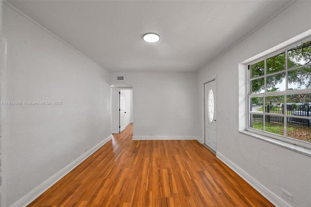 1355 NW 121st St, North Miami, FL 33167 - unfurnished room with wood finished floors and crown molding