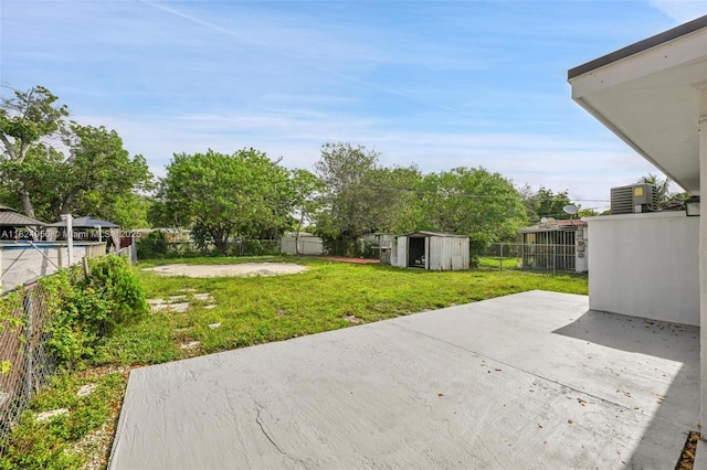 1355 NW 121st St, North Miami, FL 33167 - fenced backyard with a patio area and a storage shed