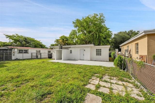 1355 NW 121st St, North Miami, FL 33167 - back of house featuring a patio and stucco siding
