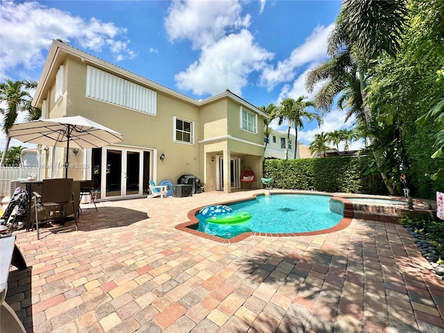 11360 NW 48th Ter, Doral, FL 33178 - view of pool with french doors, a patio area, and a pool with connected hot tub